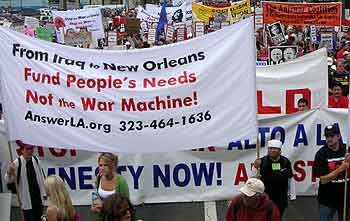 From Iraq to New Orleans, fund people's needs. Antiwar banner