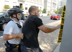Arrest in DC for putting up antiwar posters