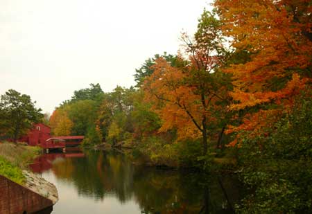 Fall foliage.Small dam. Simsbury CT