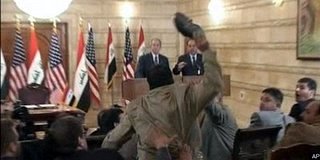 Iraqi journalist throws shoes at Bush