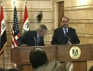 Iraqi journalist throws shoes at Bush