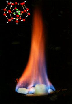 Chunk of burning methane hydrate. The inset image shows the hydrate's molecular structure: A lattice of water ice that traps the methane inside. Courtesy U.S. Geological Survey. Via Wired 