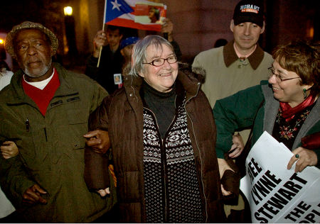 Lynne F. Stewart with husband, Ralph Poynter on left, before surrendering on Thursday. (John Marshall Mantel for The New York Times)