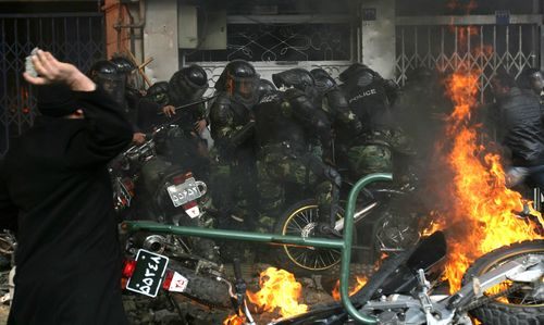 trapped-baseej. Photos: AFP/Getty